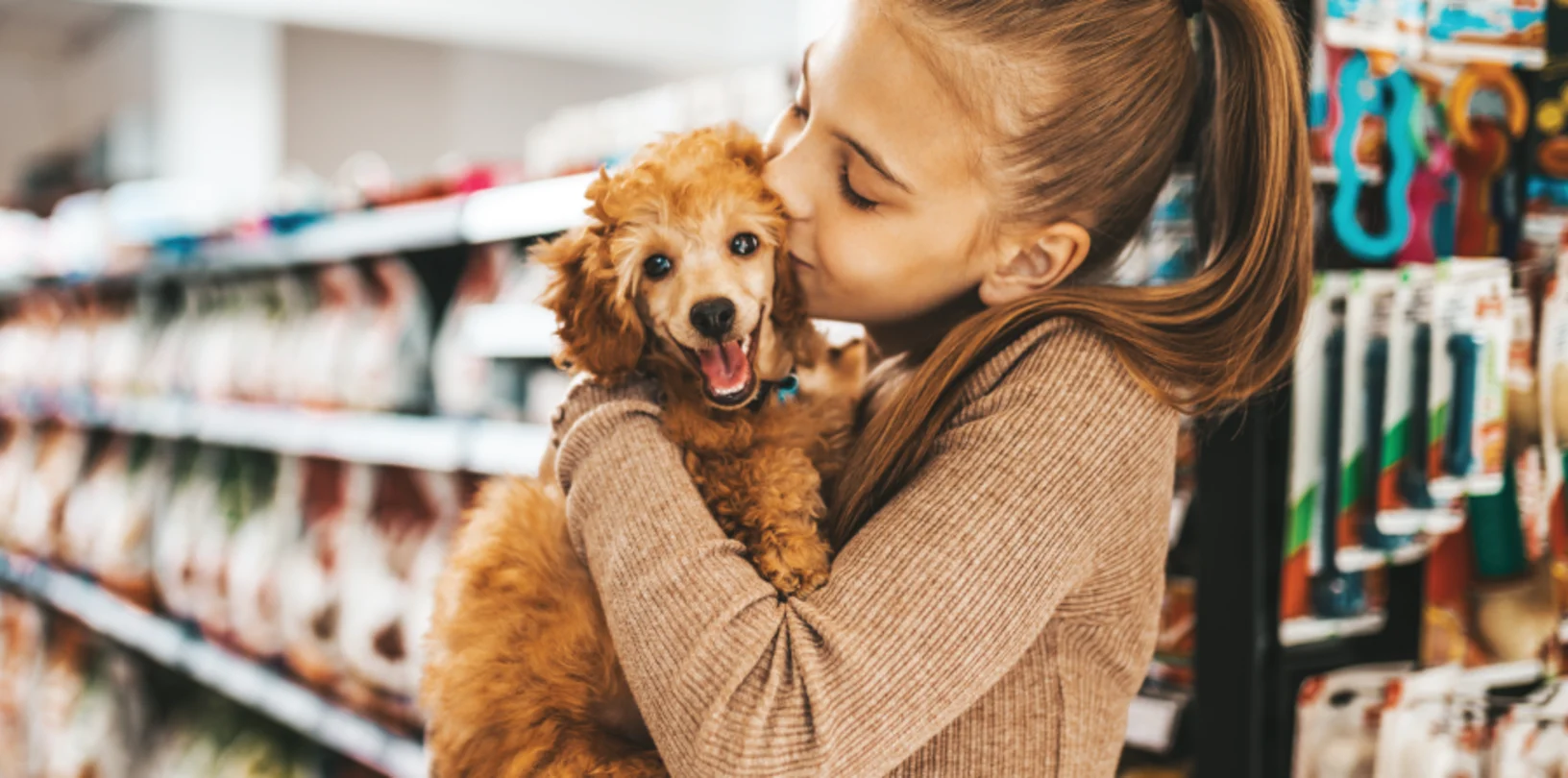 Girl kissing dog 